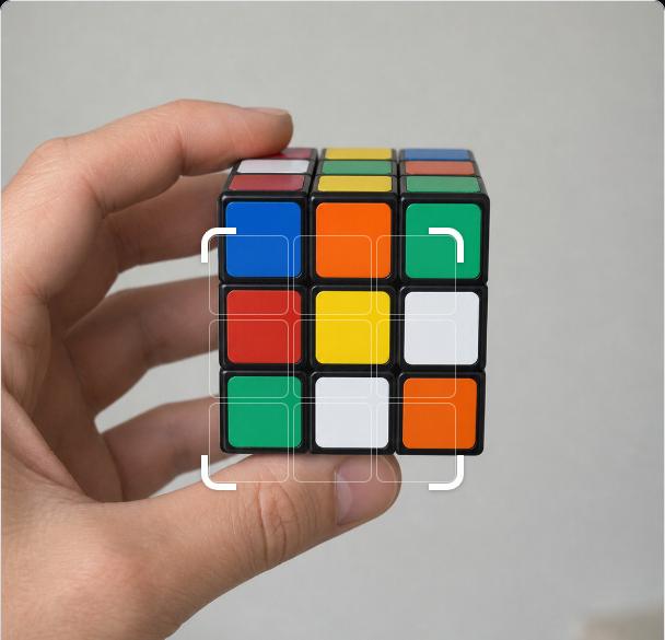 Cubeflow's scan screen: a hand holds a Rubik's cube inside a framing guide, ready to read the white face.